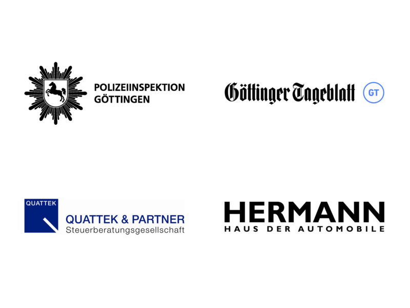 Logos von vier Organisationen – Polizeiinspektion Göttingen, Göttinger Tageblatt, Quattek & Partner Steuerberatungsgesellschaft und Hermann Haus der Automobile – sind beim Benefizlauf Laufen prominent zu sehen.